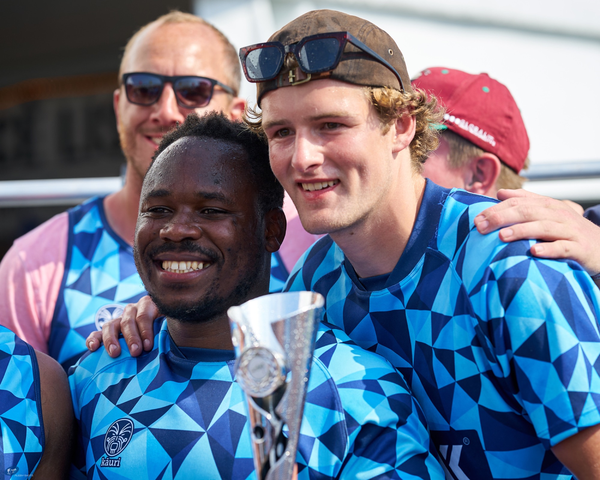 Players celebrating with a trophy